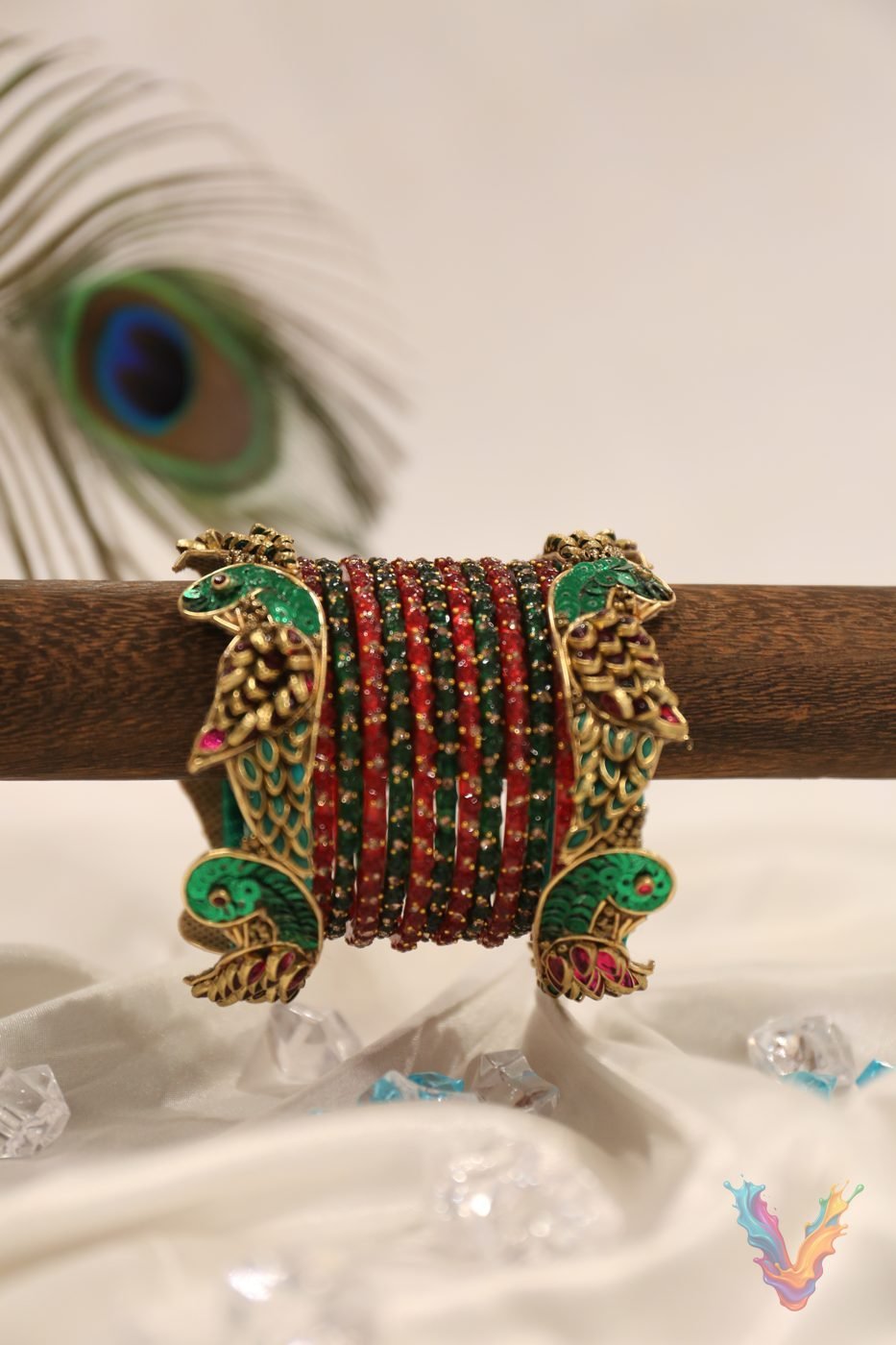 Purple velvet bangles with gold floral work and a peacock feather