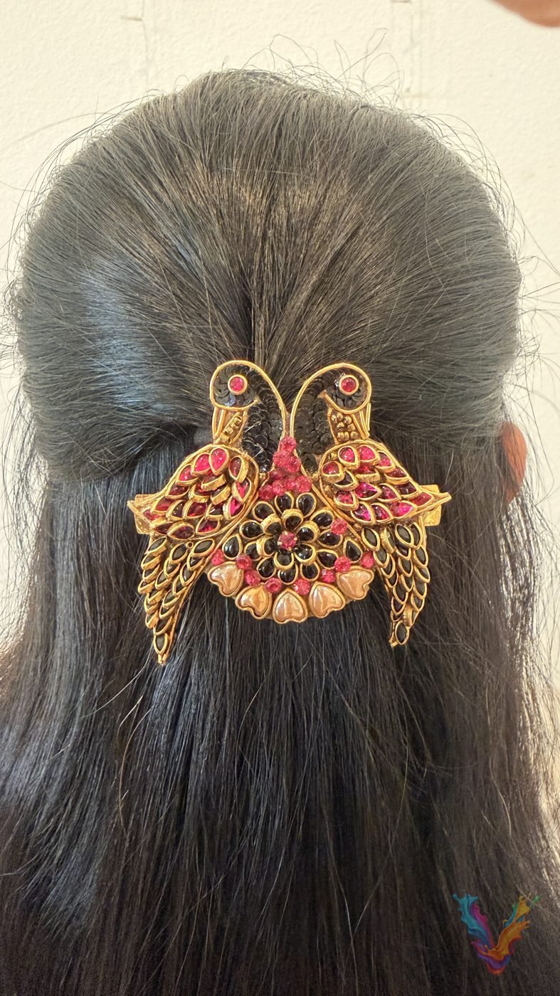 Twin peacock embellished hair clip in long dark hair