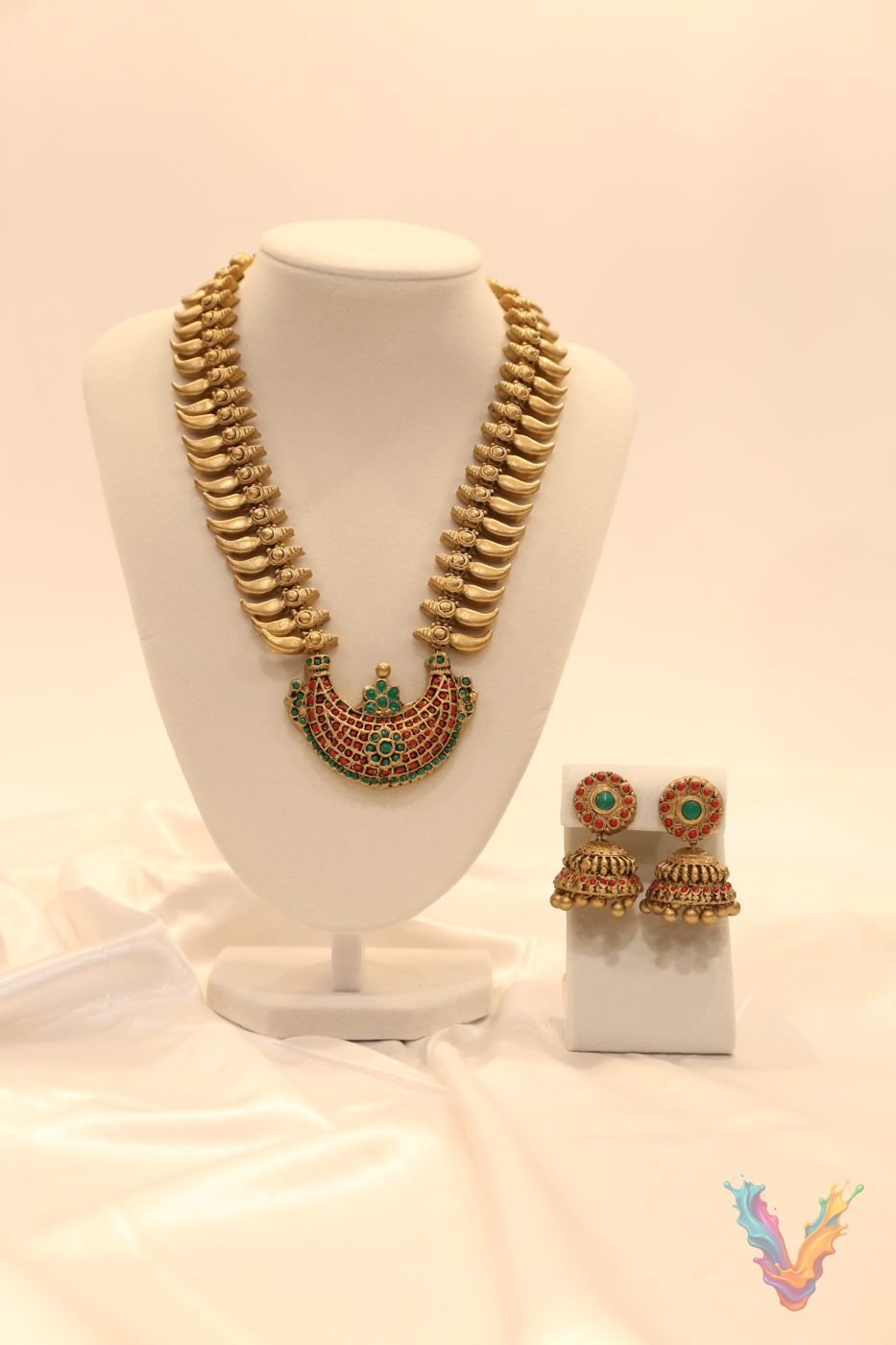 Gold terracotta necklace with a green stone pendant and earrings